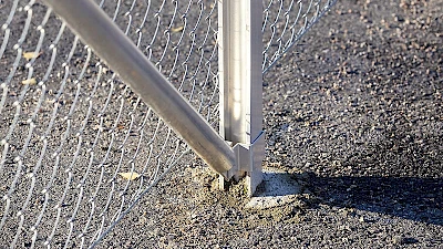 Erecting the aluminium fence posts to the ground by casted concrete