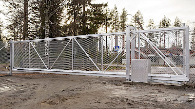 Chain link filled aluminium sliding gate and control unit in Industrial estate.