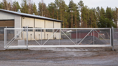 Automatic aluminium sliding gate protecting warehouse property.
