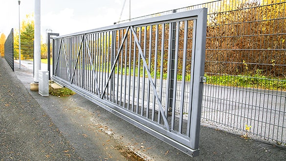 gray painted sliding gate in open position.